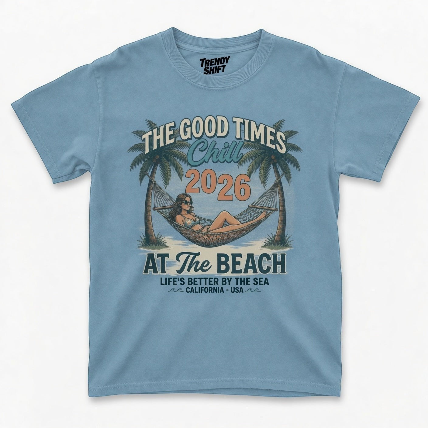 TrendyShift.Com light blue retro graphic t-shirt featuring a palm tree hammock beach scene and summer text