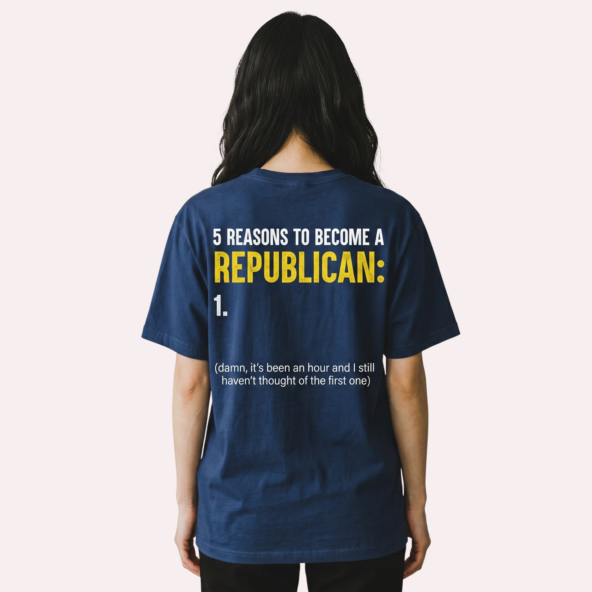 TrendyShift.Com navy blue cotton graphic t-shirt with satirical political text on the back, worn by a woman.