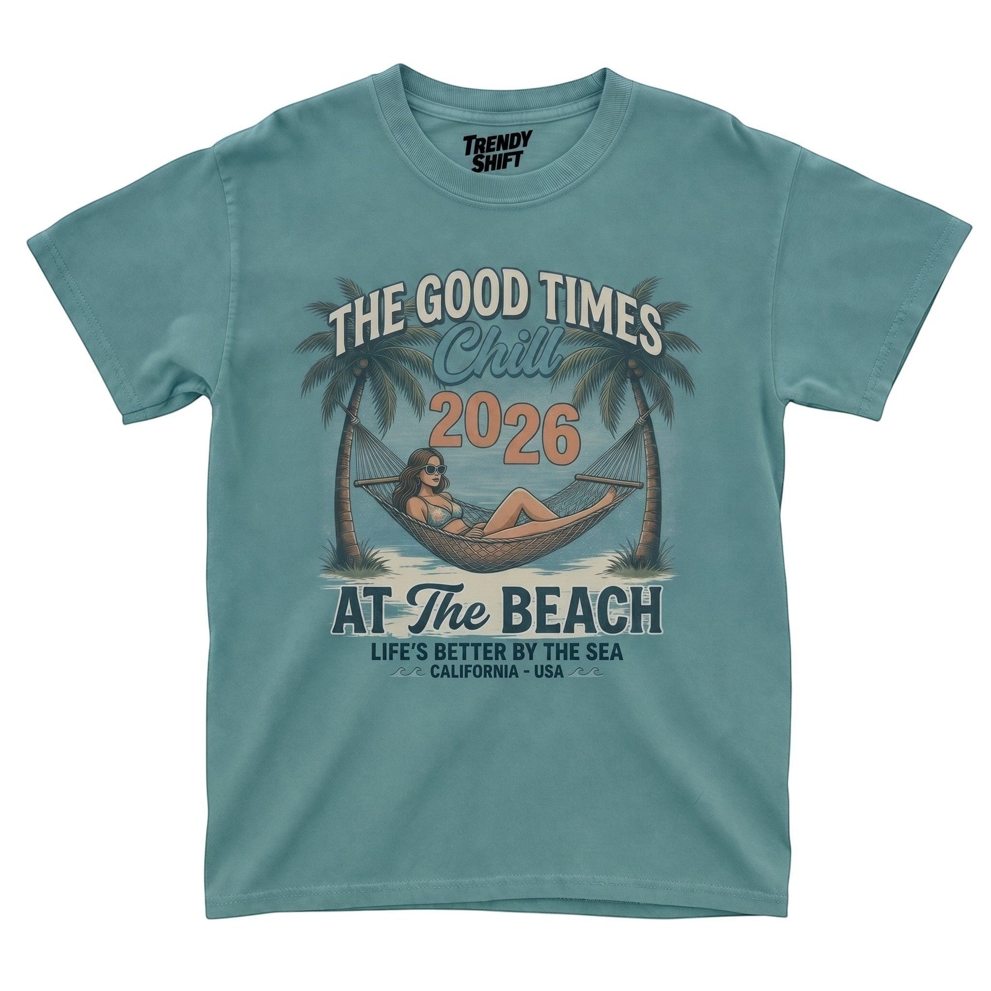 TrendyShift.Com retro teal graphic t-shirt featuring a woman in a hammock between palm trees and beach text.