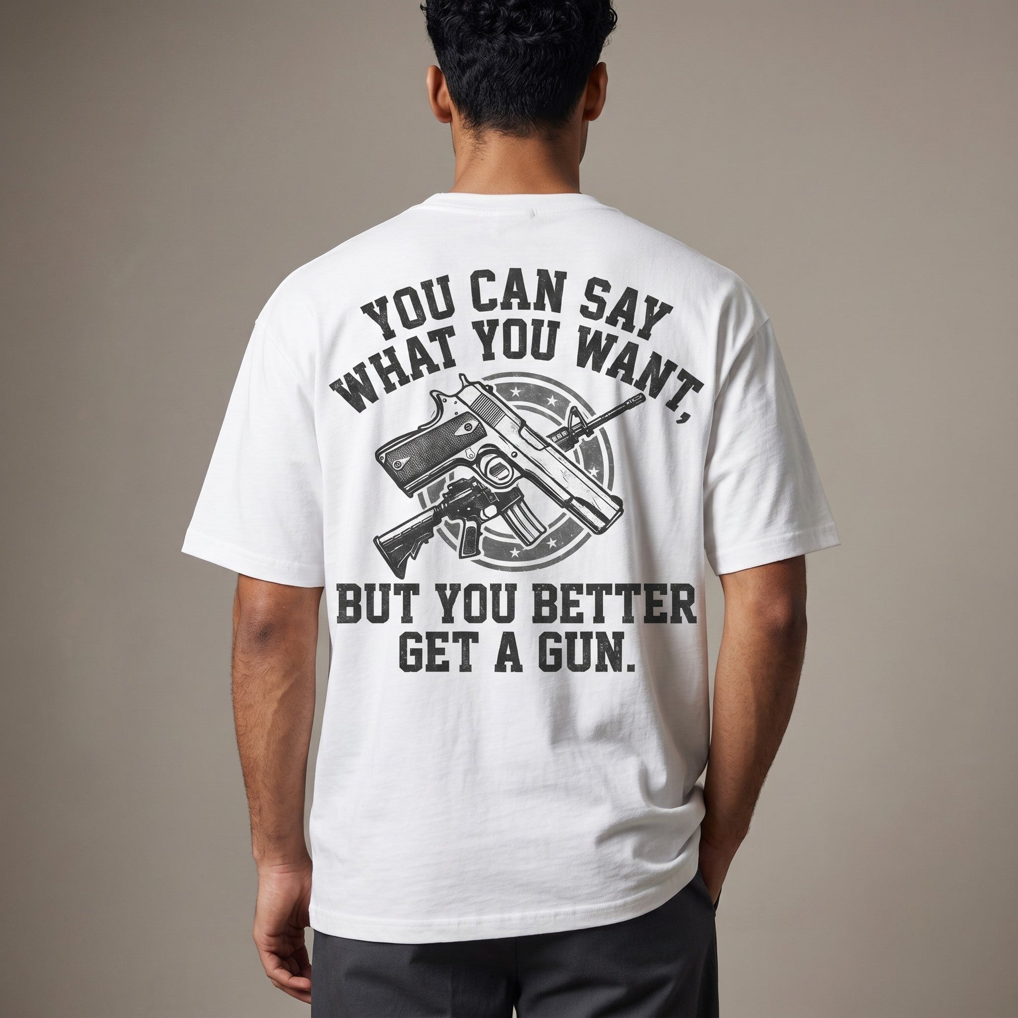 TrendyShift.Com white cotton t-shirt with back graphic print featuring firearms and bold text slogan