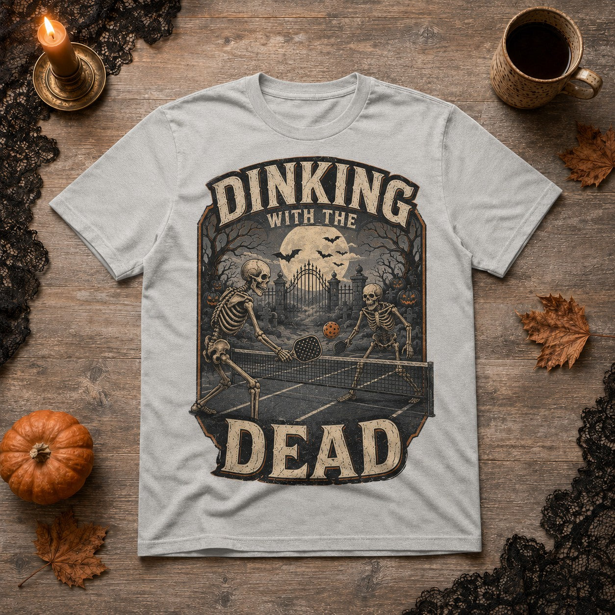 WearTheJoke.com grey cotton t-shirt featuring a vintage skeleton pickleball graphic for Halloween.