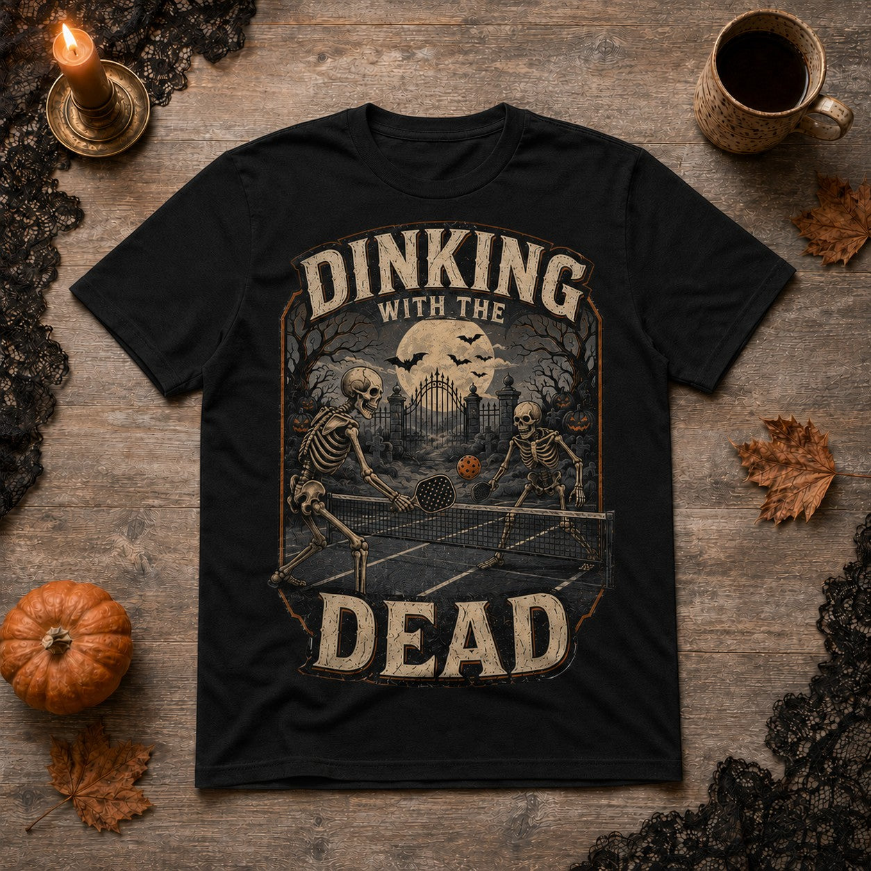 WearTheJoke.com black cotton t-shirt featuring a vintage skeleton pickleball graphic for Halloween.