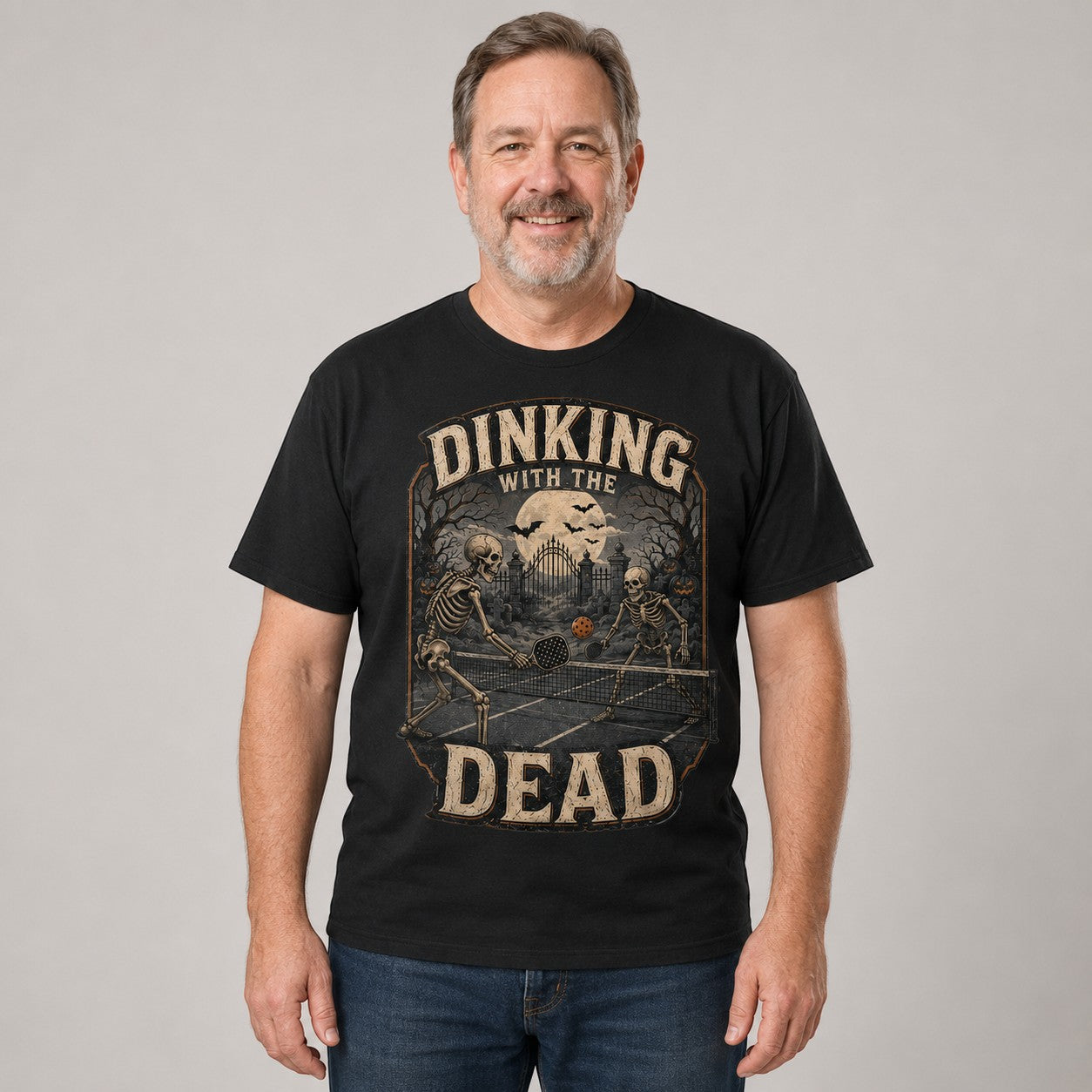 WearTheJoke.com black cotton t-shirt featuring a vintage skeleton pickleball graphic for Halloween